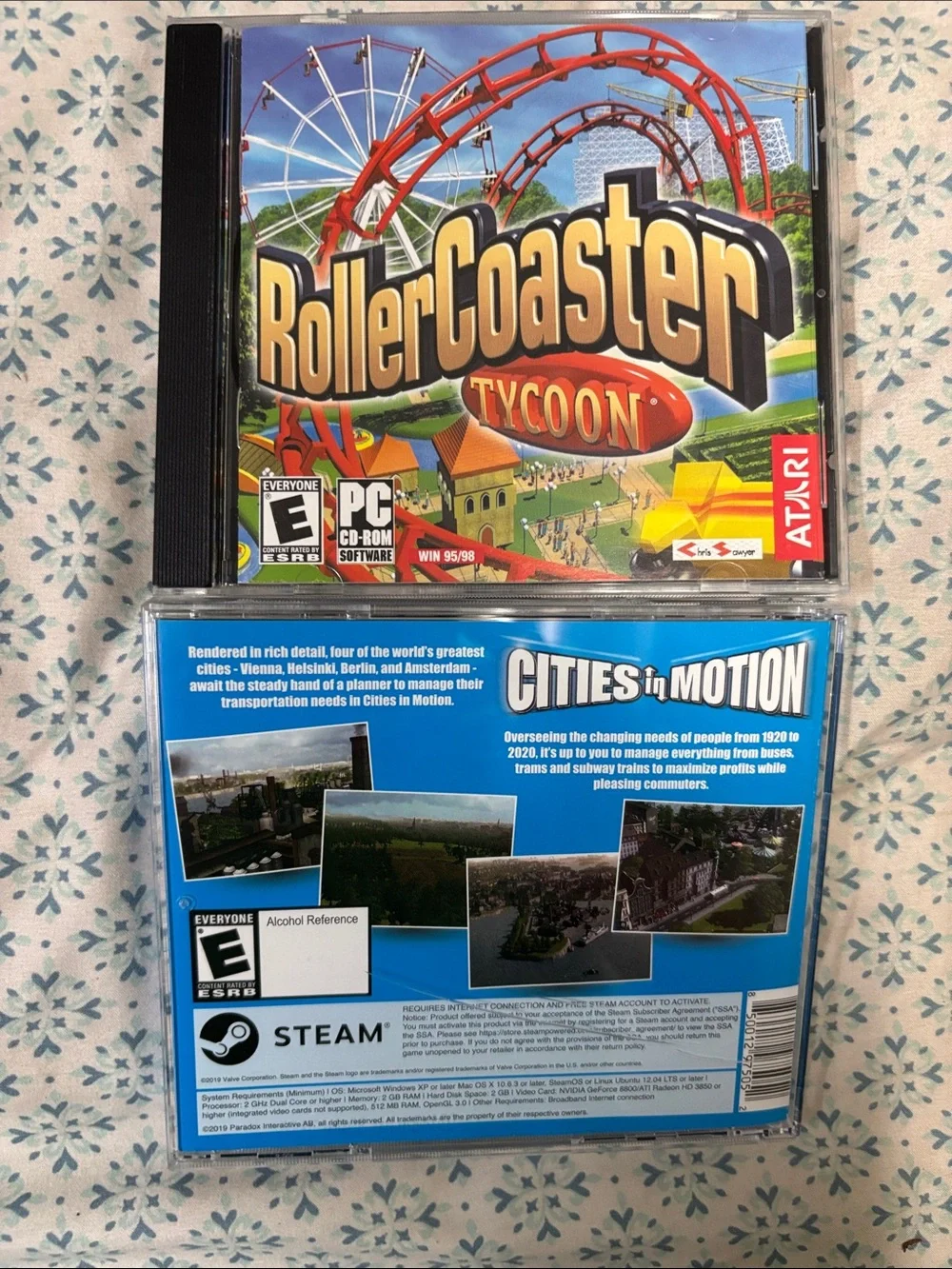 Atari RollerCoaster Tycoon & Paradox Cities in Motion PC Game Bundle - Red, Blue